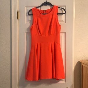 Beautiful orange dress and it hugs your curves!